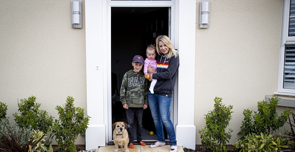 Young family with their border terrier