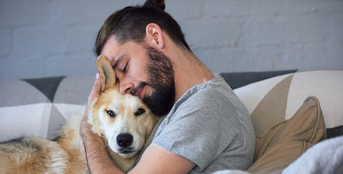 Man hugging dog